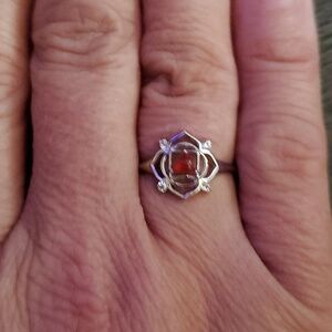 STERLING SILVER WITH REDDISH ORANGY STONE